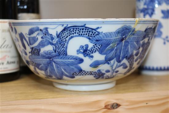 Two Chinese blue and white bowls and a famille rose bowl, 18th/19th century (3) Diameter 23cm